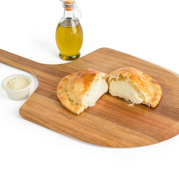 Alba's Pizzeria's calzone, sliced open to reveal a creamy ricotta filling, on a wooden pizza peel.