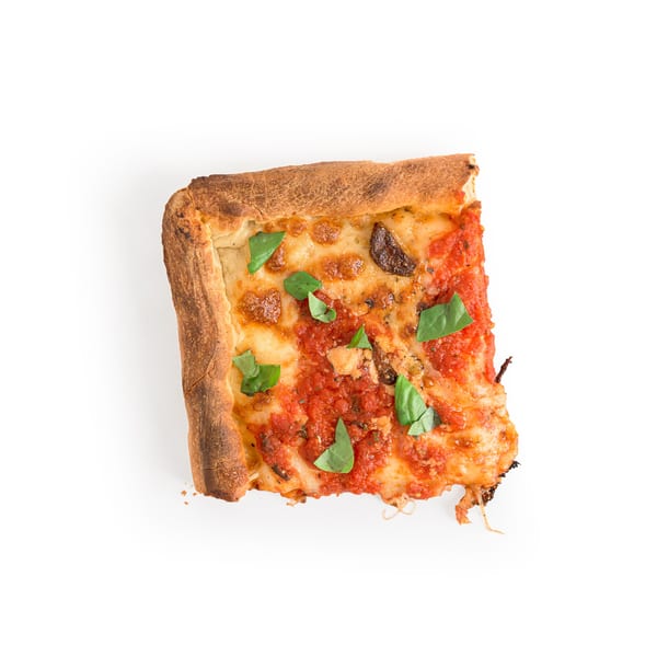 A square slice of Alba's Pizzeria & Restaurant's deep-dish pizza with tomato sauce, cheese, and basil.